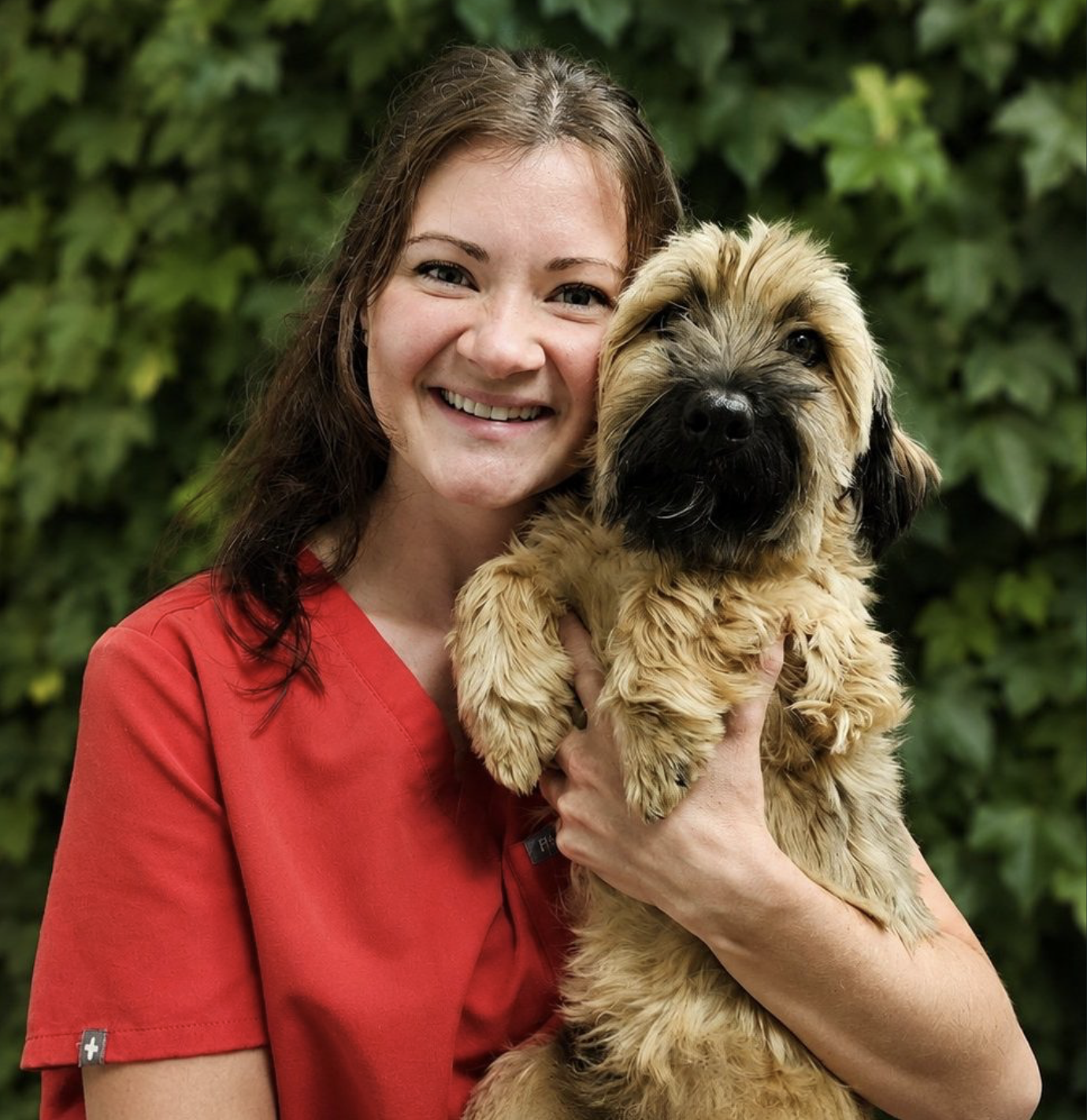 Dr. Grace, founder of Graceful Journey LLC, with her dog